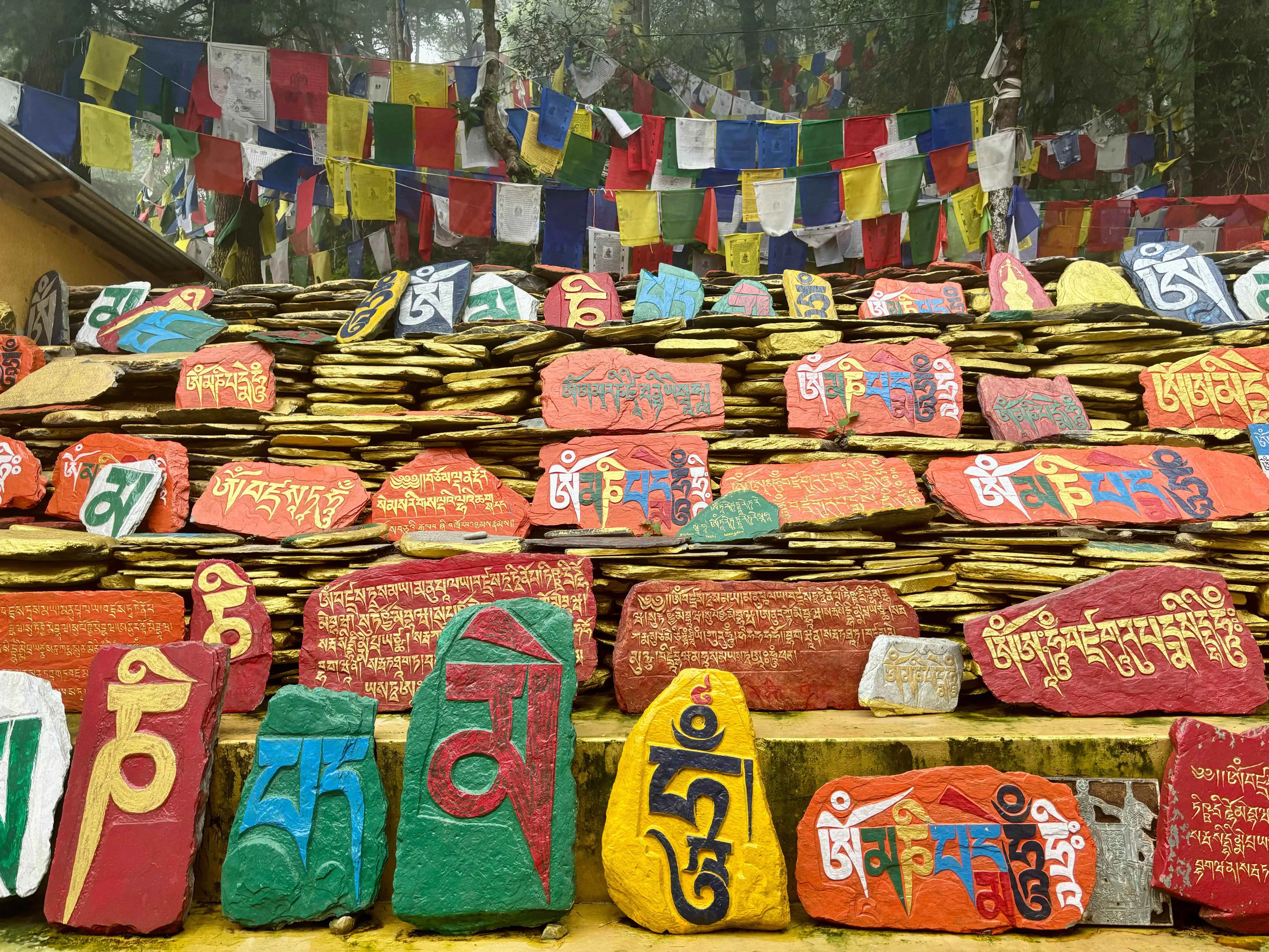 Tibetan prayer stones and prayer flags.